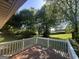 Open-air back deck with a calming view of the lush green backyard, promoting a serene outdoor experience at 2836 Belaire Cir, Doraville, GA 30340