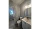 A sleek modern bathroom featuring updated fixtures and stylish vanity at 2836 Belaire Cir, Doraville, GA 30340