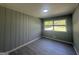 Bedroom with gray walls, new floors, one window and a ceiling light fixture at 2836 Belaire Cir, Doraville, GA 30340