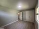 A spacious bedroom features neutral colored walls and laminate wood flooring at 2836 Belaire Cir, Doraville, GA 30340
