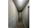 Hallway featuring newly installed floors and neutral paint leading to the various rooms of the home at 2836 Belaire Cir, Doraville, GA 30340