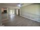 Spacious living room featuring newly installed floors, neutral paint and a ceiling fan at 2836 Belaire Cir, Doraville, GA 30340