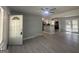 Open-concept living room that features newly installed floors, neutral paint and flows into kitchen at 2836 Belaire Cir, Doraville, GA 30340