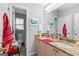 Bathroom featuring double vanity with granite countertops and a separate toilet area at 122 Ardenlee Dr, Peachtree City, GA 30269