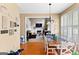Open dining area with hardwood floors that flows seamlessly into the living room at 122 Ardenlee Dr, Peachtree City, GA 30269