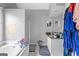 Main bathroom with a soaking tub, vanity with granite countertops, and tile floors at 122 Ardenlee Dr, Peachtree City, GA 30269