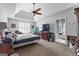Spacious main bedroom with a ceiling fan and ensuite bathroom at 122 Ardenlee Dr, Peachtree City, GA 30269