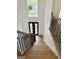 Grand two-story foyer with staircase, stylish light fixture, and front door view at 409 Saint Surrey Way, Ellenwood, GA 30294