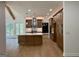 Bright, open kitchen features a large island, modern appliances, and beautiful wood cabinets at 409 Saint Surrey Way, Ellenwood, GA 30294