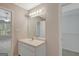 Bathroom vanity with a single sink and mirror, with access to the main bedroom and a closet at 8032 Highland Pkwy, Fairburn, GA 30213