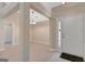 Open-concept foyer with stylish flooring and a contemporary light fixture welcomes you into this inviting home at 8032 Highland Pkwy, Fairburn, GA 30213