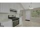 Kitchen with granite countertops, stainless steel oven, and white cabinets at 8032 Highland Pkwy, Fairburn, GA 30213