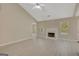 Spacious living room features light flooring, a fireplace, and neutral walls, creating a bright and inviting atmosphere at 8032 Highland Pkwy, Fairburn, GA 30213