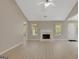 Bright and airy living room with a fireplace, light flooring, and neutral walls offers a comfortable living space at 8032 Highland Pkwy, Fairburn, GA 30213