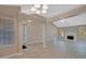Spacious living room with vaulted ceilings and a cozy fireplace at 8032 Highland Pkwy, Fairburn, GA 30213