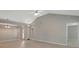 Bright living room features vaulted ceilings and neutral paint at 8032 Highland Pkwy, Fairburn, GA 30213