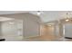 Open-concept living space with adjoining dining area and a glimpse of the kitchen at 8032 Highland Pkwy, Fairburn, GA 30213