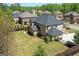 Aerial view of a brick house showing the roof and backyard in a neighborhood setting at 266 Shellbark Dr, Mcdonough, GA 30252