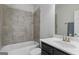 Full bathroom with bathtub, shower, toilet, and a dark wood vanity at 266 Shellbark Dr, Mcdonough, GA 30252