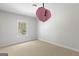 Bedroom with a hanging swing, neutral carpet, and natural light from the window at 266 Shellbark Dr, Mcdonough, GA 30252