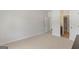 Neutral bedroom with carpet, a door leading to a bathroom, and ample space at 266 Shellbark Dr, Mcdonough, GA 30252