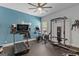 Spacious in home gym equipped with treadmill, rower, bike, and squat rack for a full body workout at 266 Shellbark Dr, Mcdonough, GA 30252
