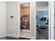 Hallway view into a laundry room and a home gym, providing convenience and fitness opportunities at 266 Shellbark Dr, Mcdonough, GA 30252