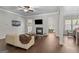 Cozy living room with hardwood floors, fireplace, and neutral-toned walls for a warm ambiance at 266 Shellbark Dr, Mcdonough, GA 30252