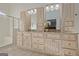 Bright bathroom featuring dual vanities with granite countertops and a glass-enclosed shower for a luxurious feel at 671 Ellison Rd, Tyrone, GA 30290