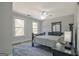 Bedroom featuring a dark bed frame and matching dresser with a mirror at 671 Ellison Rd, Tyrone, GA 30290