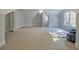 Large bonus room with neutral carpet, windows, and multiple entryways, offers versatile space at 671 Ellison Rd, Tyrone, GA 30290