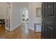 Welcoming foyer with hardwood floors and an open view to the living room with soaring windows at 671 Ellison Rd, Tyrone, GA 30290