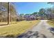 Beautiful two-story home with a brick facade, large front yard, and long driveway at 671 Ellison Rd, Tyrone, GA 30290