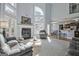 Sun-lit living room with tall ceilings, a fireplace, and an open floor plan at 671 Ellison Rd, Tyrone, GA 30290