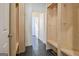 Mudroom with built-in lockers and bench seating, leading into a tiled hallway at 671 Ellison Rd, Tyrone, GA 30290