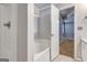 Bright bathroom features a soaking tub and neutral color palette, creating a serene and inviting atmosphere at 113 Elmwood Dr, Hampton, GA 30228