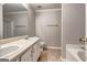 Bathroom featuring a double vanity, toilet, and tub at 113 Elmwood Dr, Hampton, GA 30228