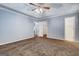 Bedroom with carpet floors and multiple doors at 113 Elmwood Dr, Hampton, GA 30228