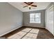 Bright bedroom with a ceiling fan, a sun-filled window, and a spacious layout for comfortable living at 113 Elmwood Dr, Hampton, GA 30228