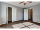 Inviting bedroom with dual closets and ample sunlight, creating a comfortable and organized living space at 113 Elmwood Dr, Hampton, GA 30228