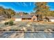 Inviting brick home with an attached garage and a well-manicured front yard at 113 Elmwood Dr, Hampton, GA 30228