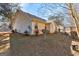 Home exterior features a well-kept yard, enhancing the property's charm and providing outdoor space at 113 Elmwood Dr, Hampton, GA 30228