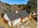 Aerial view of a charming home with a well-maintained roof, showcasing its curb appeal and structural integrity at 113 Elmwood Dr, Hampton, GA 30228