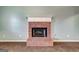 Living room with carpet featuring a beautiful fireplace in a well-lit space at 113 Elmwood Dr, Hampton, GA 30228