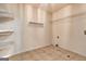 Laundry room with tiled floor and wire shelving at 113 Elmwood Dr, Hampton, GA 30228