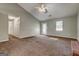 Living room boasting lots of space, carpet, a fireplace and neutral colored walls at 113 Elmwood Dr, Hampton, GA 30228