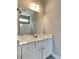 Bathroom vanity featuring dual sinks, modern fixtures, and a white countertop at 1820 Cobblefield Cir, Dacula, GA 30019