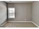 Bedroom featuring neutral carpet, a window with blinds, and neutral-colored walls at 1820 Cobblefield Cir, Dacula, GA 30019