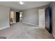 Spacious carpeted bedroom with an ensuite bathroom and walk-in closet at 1820 Cobblefield Cir, Dacula, GA 30019