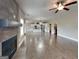 Open concept living space with modern fireplace, hardwood flooring, and seamless flow into the kitchen at 1820 Cobblefield Cir, Dacula, GA 30019